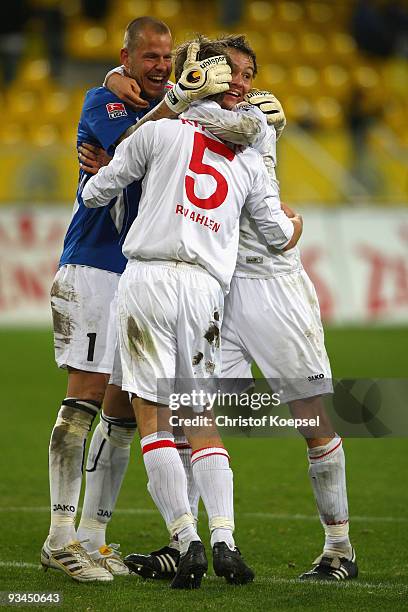 Sascha Kirschstein, Nils Doering and Ole Kittner of Ahlen celebrate the 2-0 victory after the second Bundesliga match between Alemannia Aachen and...