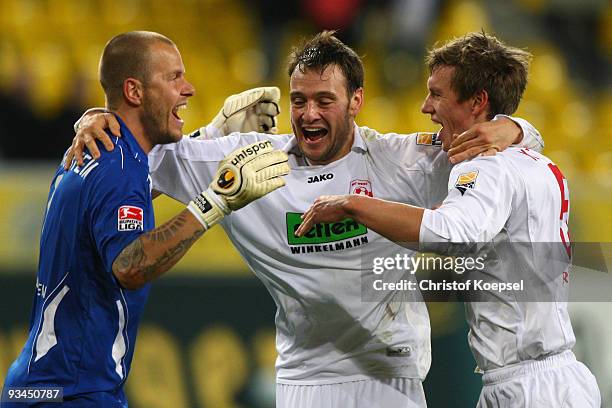 Sascha Kirschstein, Nils Doering and Ole Kittner of Ahlen celebrate the 2-0 victory after the second Bundesliga match between Alemannia Aachen and...