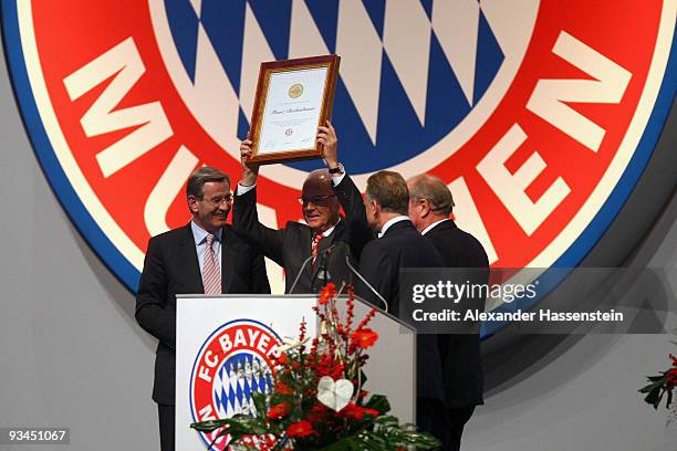 Franz Beckenbauer , President of Bayern Muenchen gets the honorary team captain award from Karl Hopfner , Karl-Heinz Rummenigge and Uli Hoeness...