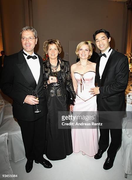 German Environment Minister Norbert Roettgen with his wife Ebba Herfs-Roettgen and German Health Minister Philipp Roesler with his wife Wiebke...
