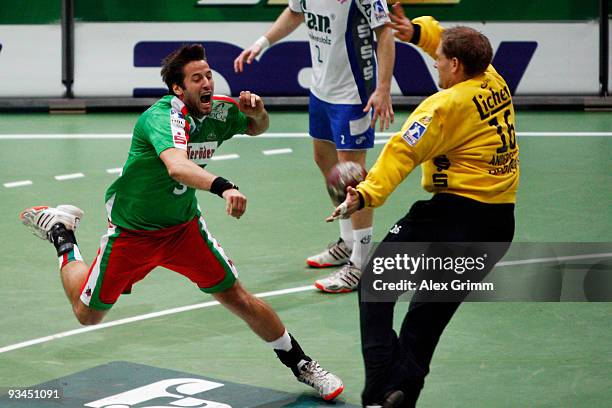 Goalkeeper Mattias Andersson of Grosswallstadt makes a save against Bartosz Jurecki of Magdeburg during the Toyota Handball Bundesliga match between...