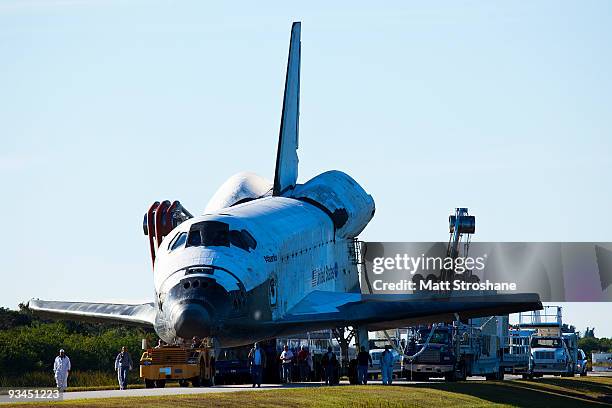 Space Shuttle Atlantis is towed back to the orbiter processing facility after landing successfully earlier at Kennedy Space Center November 27, 2009...