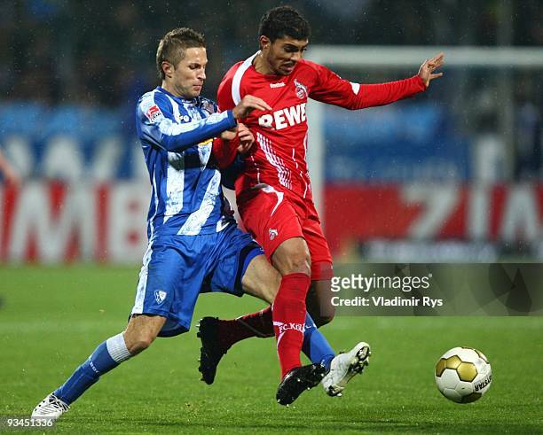 Stanislav Sestak of VfL Bochum battles for the ball with Adil Chihi of FC Koeln during the Bundesliga match between VfL Bochum and 1. FC Koeln at...