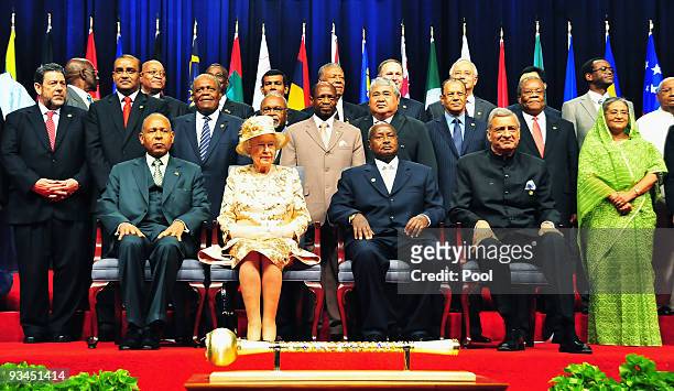 Queen Elizabeth II sits with the Commonwealth Leaders and Heads of Government as they pose for the official photo at the Opening Ceremony for the...