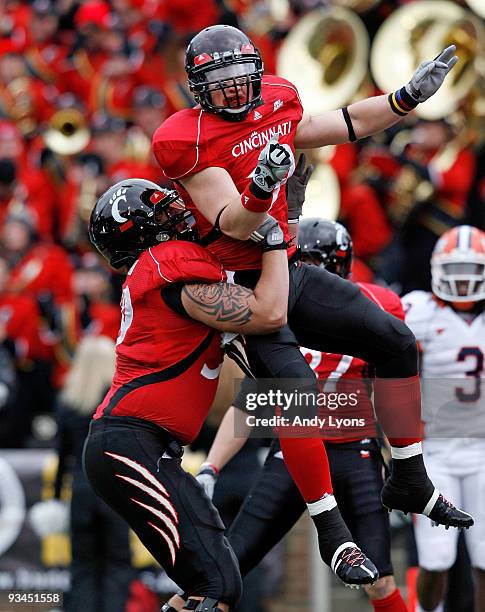 Ben Guidugli and Alex Hoffman of the Cincinnati Bearcats celebrate after Guidugli caught a touchdown pass during the game against the Illinois...