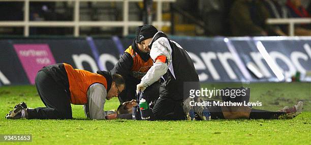 Micky Youngs of Newcastle Falcons receives attention during the Guinness Premiership match between Newcastle Falcons and Northampton Saints at...