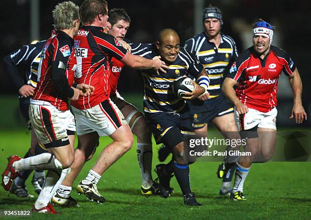 Tevita Taumoepeau of Worcester Warriors is tackled by Ernst Joubert of Saracens during the Guinness Premiership match between Worcester Warriors and...