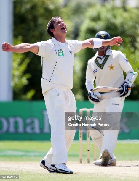 Shane Bond of New Zealand celebrates the wicket of Khurram Manzoor of Pakistan during day five of the First Test match between New Zealand and...