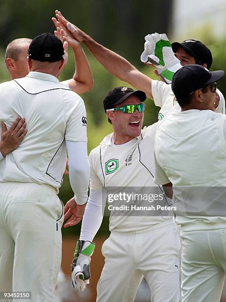 Brendon McCullum of New Zealand celebrates the wicket of Imran Farhat of Pakistan during day five of the First Test match between New Zealand and...