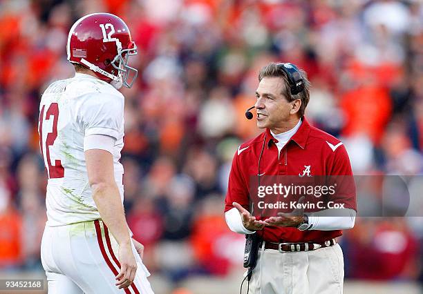 Head coach Nick Saban of the Alabama Crimson Tide converses with quarterback Greg McElroy during the game against the Auburn Tigers at Jordan-Hare...