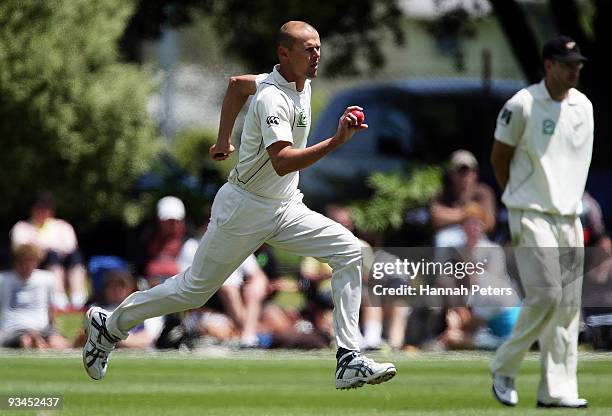 Chris Martin of New Zealand runs into bowl during day five of the First Test match between New Zealand and Pakistan at the University Oval on...