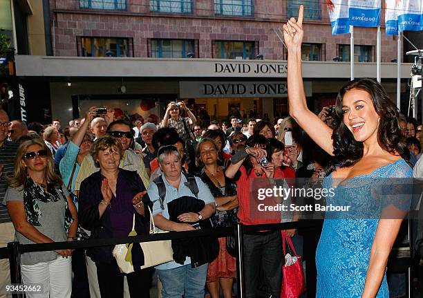 Model Megan Gale gestures after officially opening Stage One of the David Jones Bourke Street Mall Store during the official opening of stage one of...