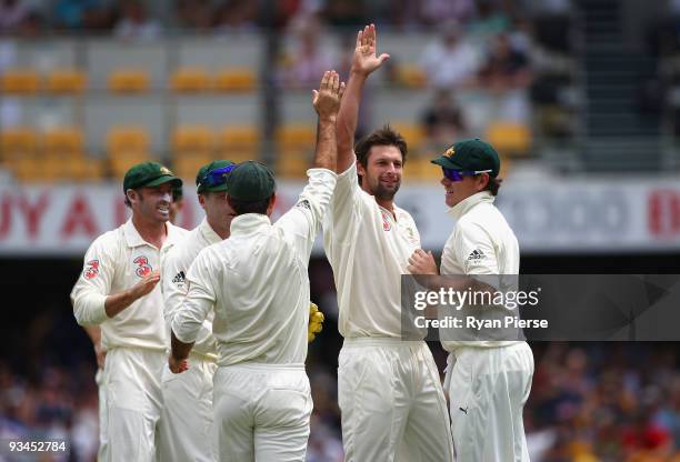 Ben Hilfenhaus of Australia celebrates after claiming the wicket of Chris Gayle of the West Indies during day three of the First Test match between...