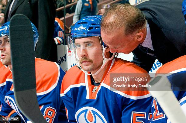 Colin McDonald of the Edmonton Oilers is given a quick pep talk by Kelly Buchberger before he started in his first ever NHL game against the San Jose...