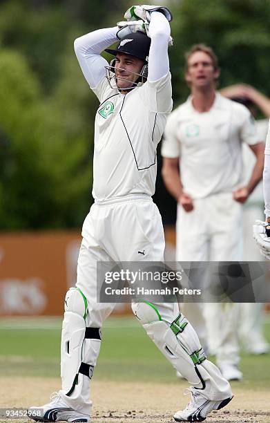 Brendon McCullum of New Zealand shows his frustration after letting a ball slip through during day five of the First Test match between New Zealand...