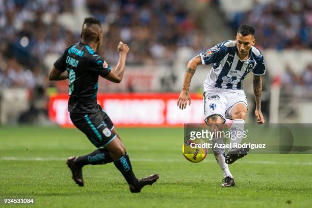 Leonel Vangioni of Monterrey fights for the ball with Yerson Candelo of Queretaro during the 12th round match between Monterrey and Queretaro as part...