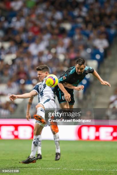 Arturo Gonzalez of Monterrey fights for the ball with George Corral of Queretaro during the 12th round match between Monterrey and Queretaro as part...