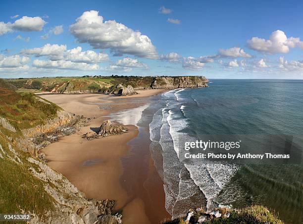 cliffs and beach - welsh hills stock pictures, royalty-free photos & images