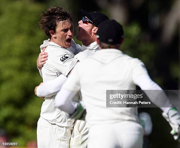 Shane Bond of New Zealand celebrates after catching Umar Akmal out for 75 runs off his own bowling during day five of the First Test match between...