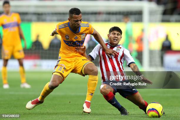 Javier Lopez of Chivas fights for the ball with Rafael de Souza of Tigres during the 12th round match between Chivas and Tigres UANL as part of the...