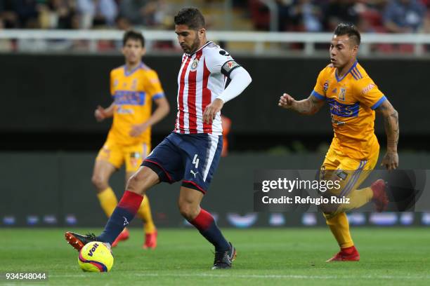 Jair Pereira of Chivas fights for the ball with Eduardo Vargas of Tigres during the 12th round match between Chivas and Tigres UANL as part of the...