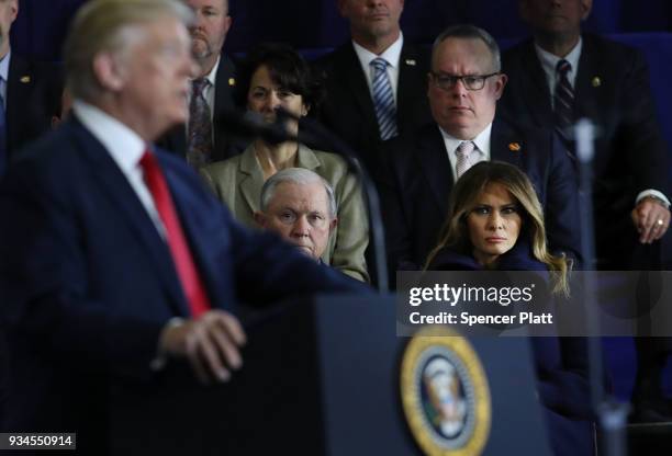 Attorney General Jeff Sessions and first lady Melania Trump watch as President Donald Trump, speaks to supporters, local politicians and police...