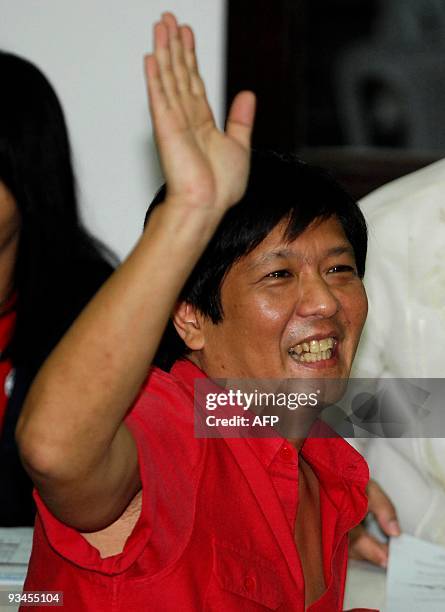 Ferdinand 'Bongbong' Marcos Jr., the son of former president Ferdinand Marcos waves before he files his Certificate of Candidacy at the Commission of...