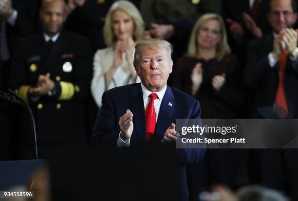 President Donald Trump arrives to speak to supporters, local politicians and police officers at an event at Manchester Community College on March 19,...