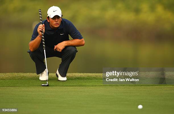 Francesco Molinari of Italy lines up a put during the Fourballs on the 3rd day of the Omega Mission Hills World Cup on the Olazabal course on...