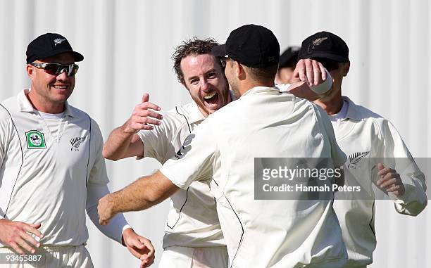 Iain O'Brien of New Zealand celebrates the wicket of Umar Gul of Pakistan caught for four runs by Daniel Vettori during day five of the First Test...