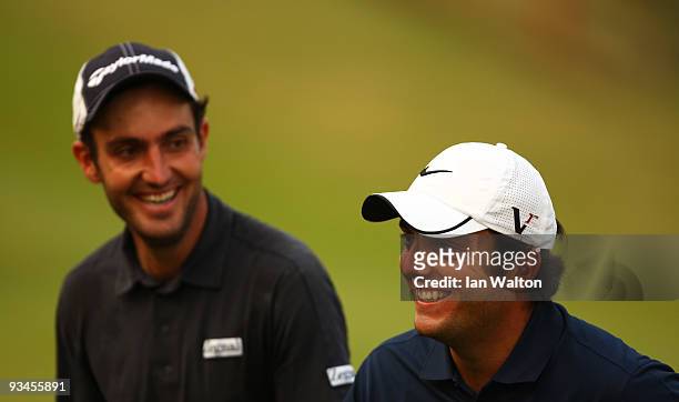 Francesco Molinari and Edoardo Molinari of Italy look on during the Fourballs on the 3rd day of the Omega Mission Hills World Cup on the Olazabal...