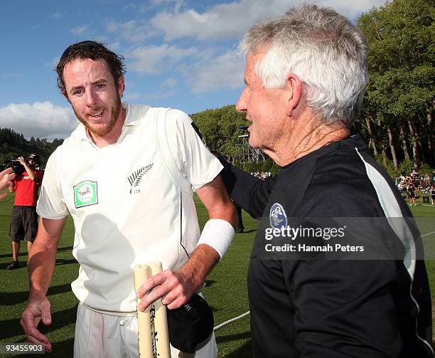 Iain O'Brien of New Zealand is congratulated by team manager Dave Currie after winning the First Test match between New Zealand and Pakistan at the...