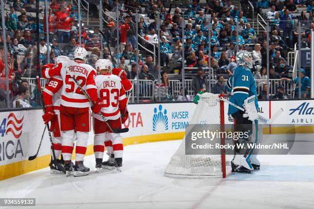 Gustav Nyquist of the Detroit Red Wings celebrates with teammates after scoring a goal against the San Jose Sharks at SAP Center on March 12, 2018 in...