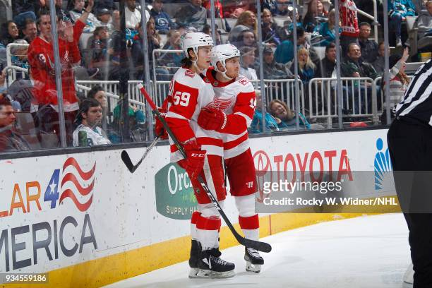 Gustav Nyquist of the Detroit Red Wings celebrates with teammate Tyler Bertuzzi after scoring a goal against the San Jose Sharks at SAP Center on...