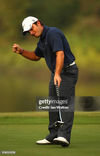 Francesco Molinari of Italy celerates a put on the 18th green during the Fourballs on the 3rd day of the Omega Mission Hills World Cup on the...