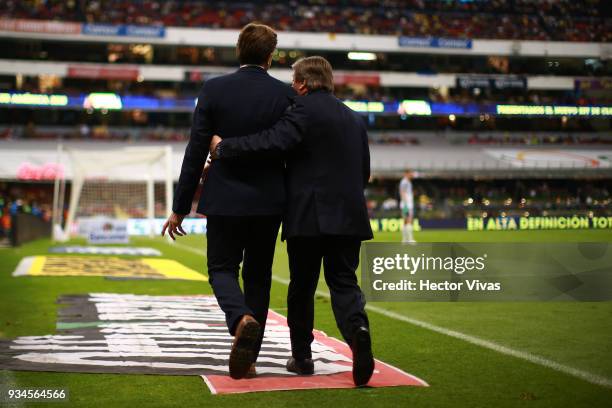Hernan Cristante, Coach of Toluca and Miguel Herrera, Coach of America leave the field after being expelled during the 12th round match between...