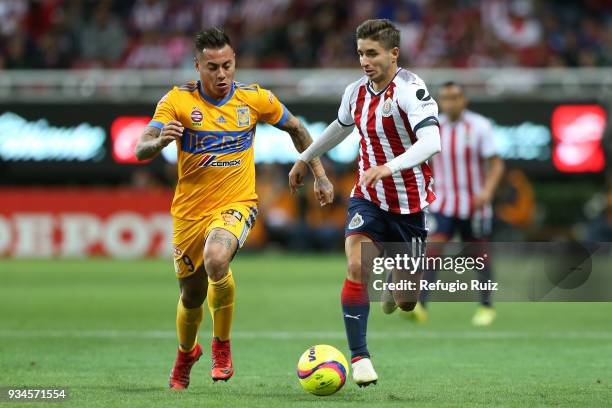 Isaac Brizuela of Chivas fights for the ball with Eduardo Vargas of Tigres during the 12th round match between Chivas and Tigres UANL as part of the...