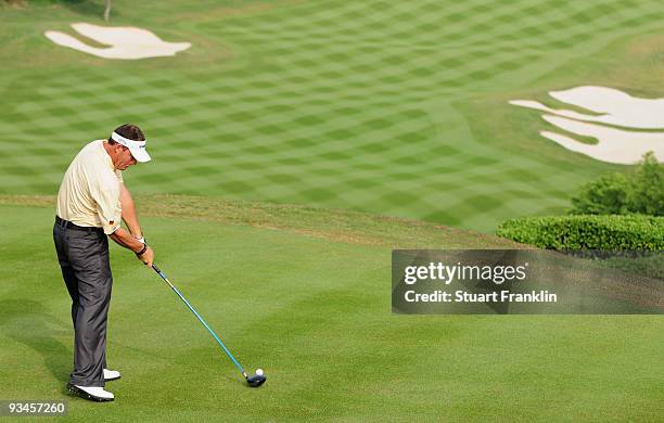 Alex Cejka of Germany plays his tee shot on the first hole during Fourball on the third day of the Omega Mission Hills World Cup on the Olazabal...