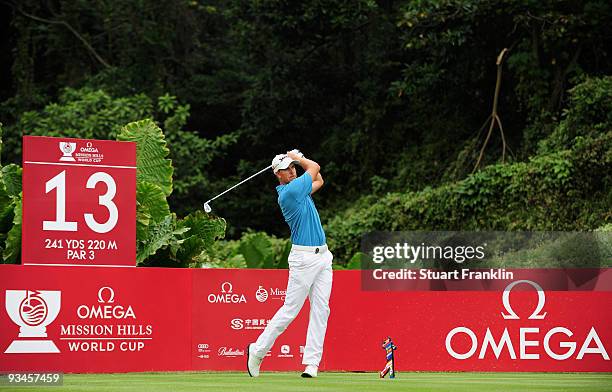 Henrik Stenson of Sweden plays his tee shot on the 13th hole during Fourball on the third day of the Omega Mission Hills World Cup on the Olazabal...