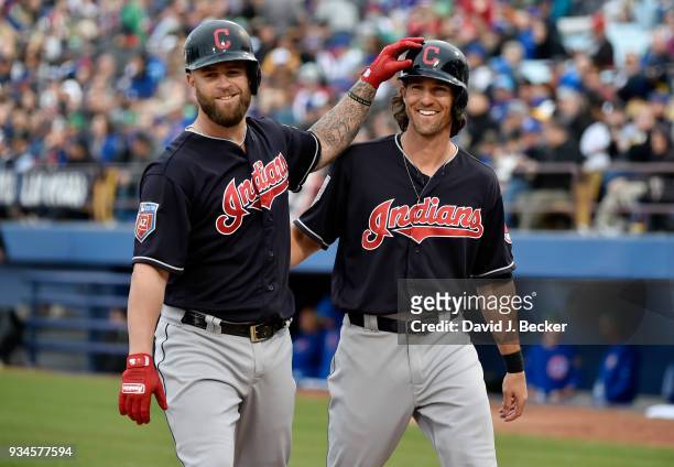 Gabriel Mejia and Drew Maggi of the Cleveland Indians react after Mejia hit a two-run home run against the Chicago Cubs during an exhibition game at...