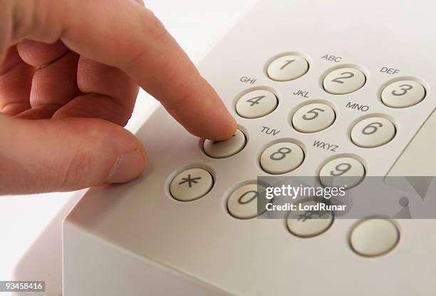 dialing seven - finger dialing touch tone telephone stock pictures, royalty-free photos & images