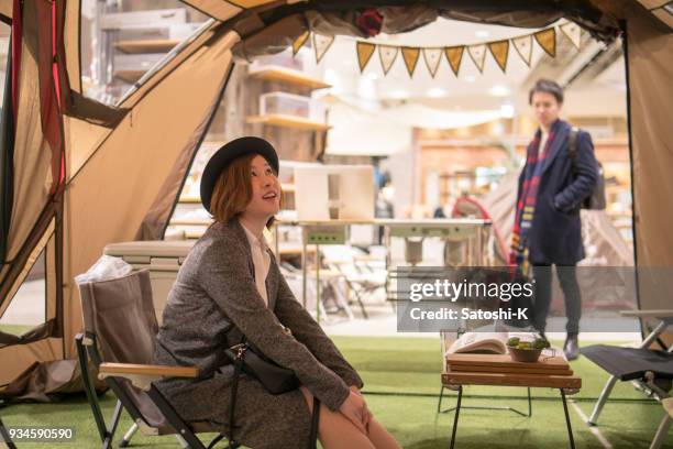 young couple shopping for barbeque party - japanese tents stock pictures, royalty-free photos & images