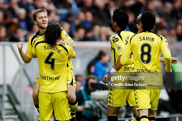 Jakub Blaszczykowski of Dortmund celebrates scoring his team's first goal with team mates Neven Subotic, Lucas Barrios and Nuri Sahin during the...