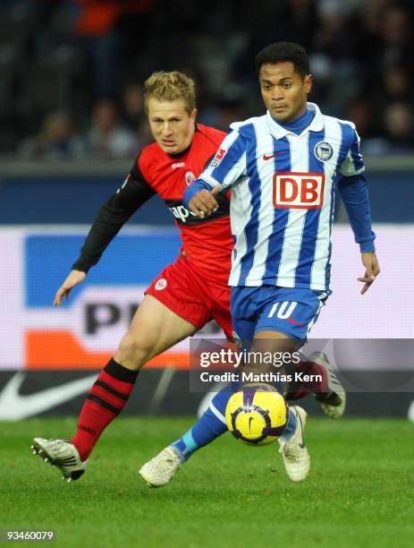 Raffael of Berlin battles for the ball with Christoph Spycher of Frankfurt during the Bundesliga match between Hertha BSC Berlin and Eintracht...