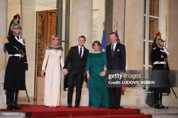 France's President Emmanuel Macron and his wife Brigitte Macron greet Grand Duke Henri of Luxembourg and Grand Duchess of Luxembourg Maria-Teresa...