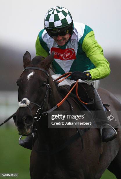 Ruby Walsh and Denman pull away from the last fence before going on to win The Hennessy Cognac Gold Cup Steeple chase Race run at Newbury Racecourse...