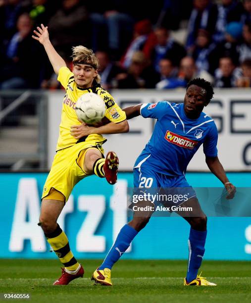 Marcel Schmelzer of Dortmund and Chinedu Obasi of Hoffenheim battle for the ball during the Bundesliga match between 1899 Hoffenheim and Borussia...