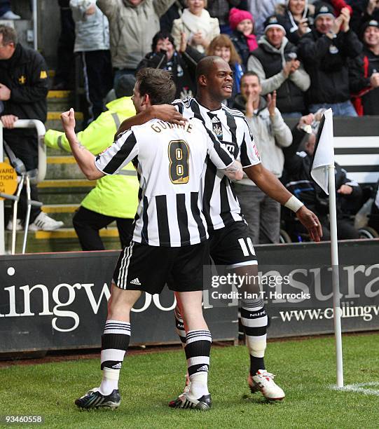 Marlon Harewood of Newcastle United celebrates with Danny Guthrie after scoring the opening goal during the Coca-Cola Championship game between...