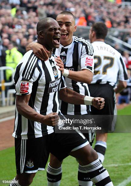 Marlon Harewood of Newcastle United celebrates with Danny Simpson after scoring the opening goal during the Coca-Cola Championship game between...