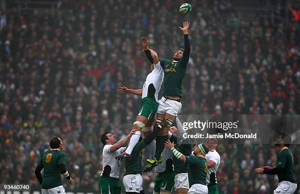 Donncha O�Callaghan of Ireland jumps with Andries Bekker of South Africa in the lineout during the Guinness Series 2009 match between Ireland and...